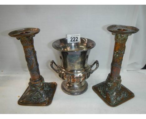 A pair of early 20th century plated candlesticks and a twin handled urn. 