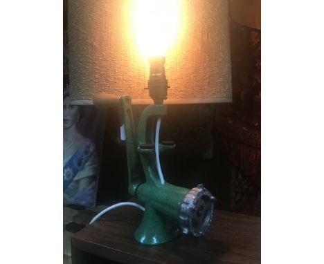 A Vintage enamelled mincer converted into a table lamp. In a working condition.