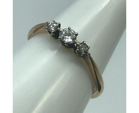 A Lovely 18ct gold ladies ring set with three diamonds, Ring size N, Weighs 1.98grams 
