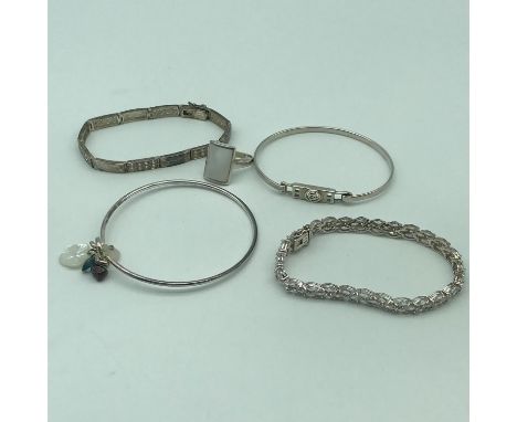A Lot of 4 Sterling 925 bracelets/ bangles together with a 925 and mother of pearl set ring. 