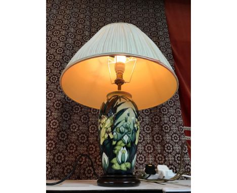 A Moorcroft art pottery cream ground lamp base, overall decorated with tube lined designs of water lilies, bull rushes and ir