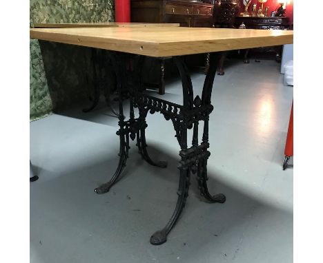 A Heavy cast iron base, solid light oak top table, Ideal for kitchen table. Measures 71x90x75cm 