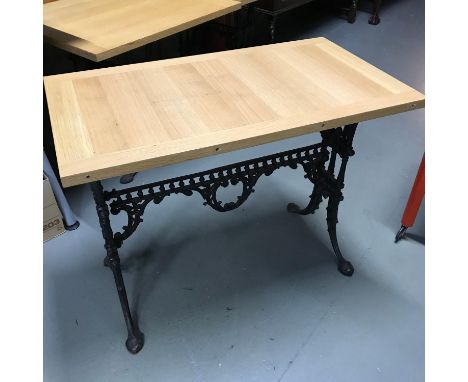 A Heavy cast iron base, solid light oak top table, Ideal for kitchen table. Measures 71x90x50cm 