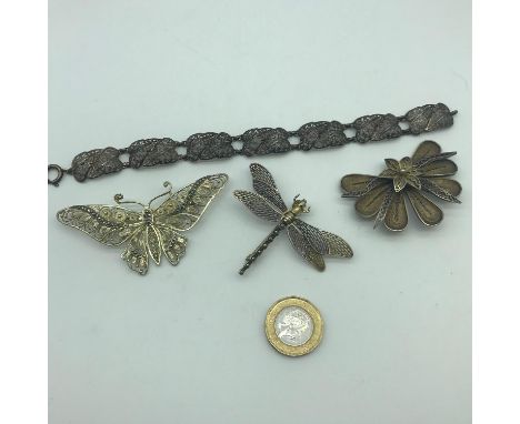 A Lot of 4 silver filigree jewellery items, Which includes  800 grade bracelet, 800 grade butterfly brooch, 800 grade unusual