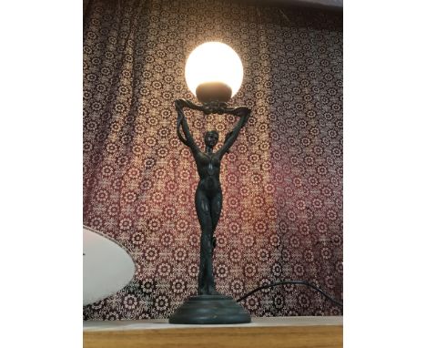 A Bronzed effect art deco lady table lamp. In a working condition.