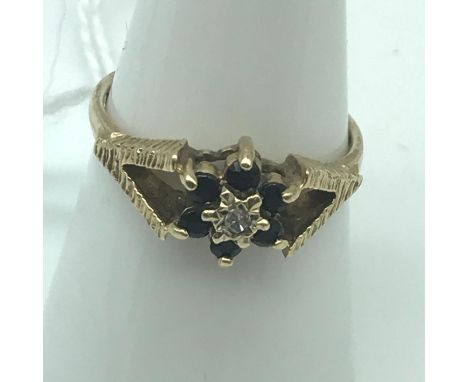 A Ladies 9ct gold sapphire cluster and single diamond set ring, Ring size N, Weighs 2.24grams 