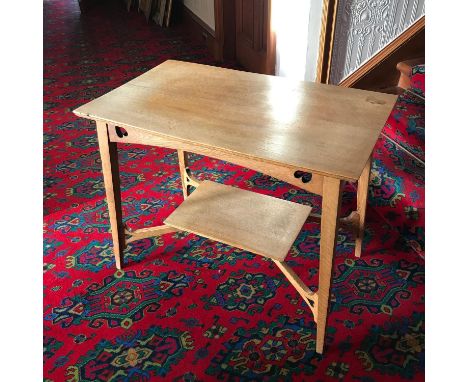 An Arts and crafts light oak two tier window table. 