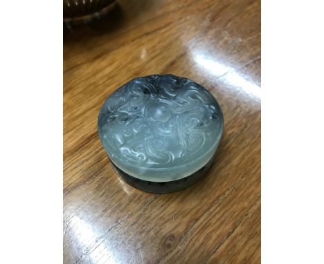 A Chinese jade trinket dish, Designed with carved top, Measures 6cm in diameter