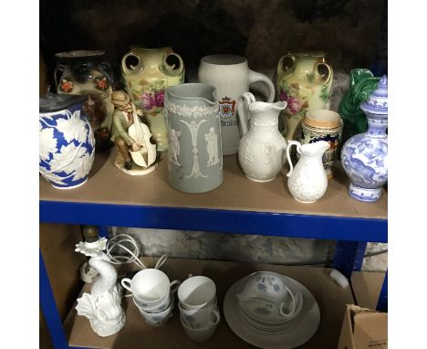 Two shelves of collectables to include Wedgwood German bear jugs &amp; Goebel fish etc 