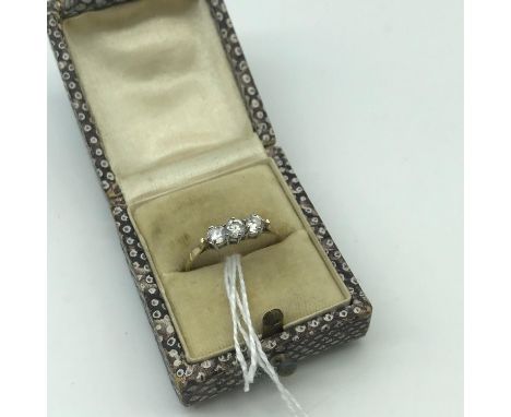 A Ladies 9ct gold ring set with three large clear stones. Ring size Q. Weighs 1.45grams 
