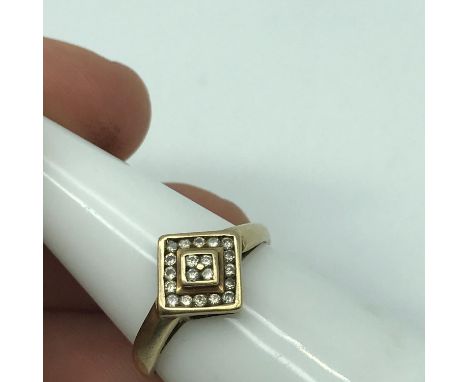 A 9ct gold ladies ring set with a diamond cluster. Ring size Q, Weighs 1.77grams 