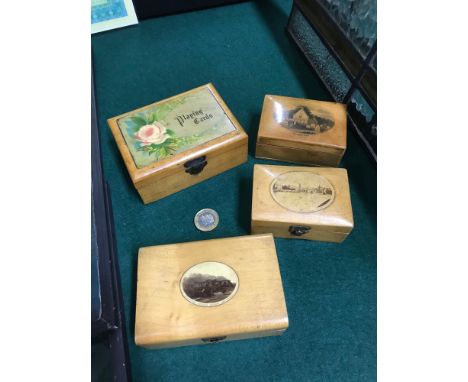 A Lot of four Mauchline ware trinket boxes. Together with an art glass perfume bottle 