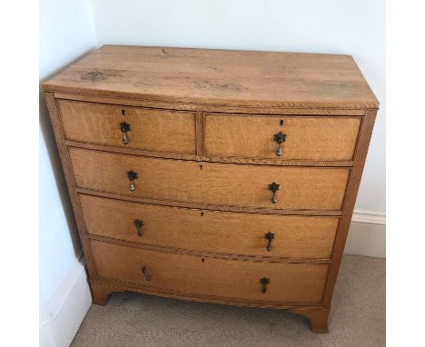 A Georgian two over three drawer light oak chest. 