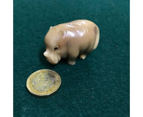 Antique Japanese hand carved netsuke of a baby rhino. Singed by the artist. 3x4x2.5cm 