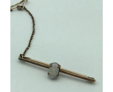 Antique 9ct gold bar brooch set with a large opal stone. Weighs 2.40grams 