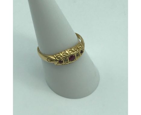 Antique Chester 18ct gold ring set with three ruby stones and two diamonds. Ring size Q, Weighs 2.56grams 