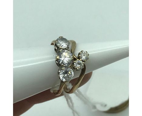 A Ladies 9ct gold ring set with three large clear stones. Together with a ladies 9ct gold ring set with two clear stones. Bot