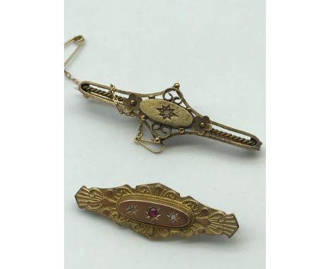 A Victorian 9ct gold ornate bar brooch set with two clear stones and single ruby stone, Together with a Victorian 15ct gold o