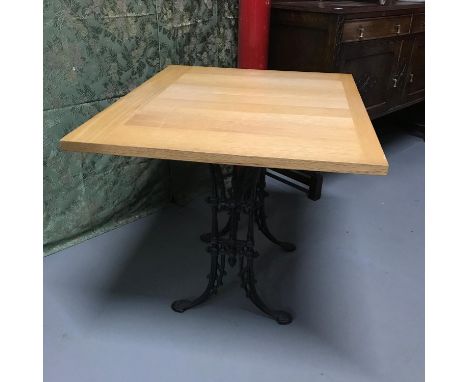 A Heavy cast iron base, solid light oak top table, Ideal for kitchen table. Measures 71x90x75cm 
