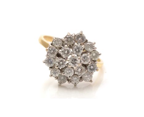 A diamond cluster ring, the target cluster set with brilliant-cut diamonds weighing a total of approximately 2.00 carats, in 