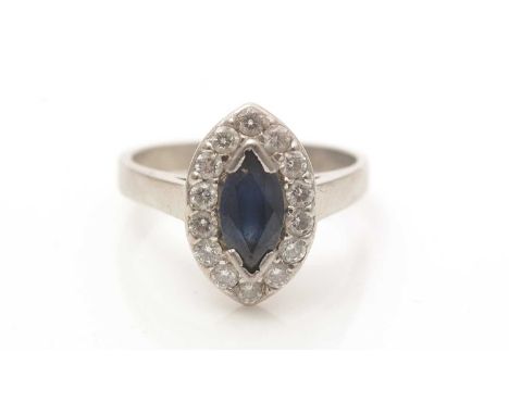 A sapphire and diamond cluster ring, the marquise-cut sapphire surrounded by brilliant-cut diamonds, in platinum mount and sh