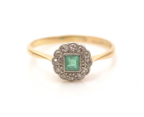 An emerald and diamond cluster ring, the square facet-cut emerald surrounded by old-cut diamonds, in platinum setting and 18c