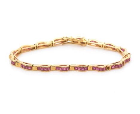 A ruby bracelet, the sixteen wavy links each set with square single-cut rubies, in 14ct yellow gold mount, the clasp stamped 