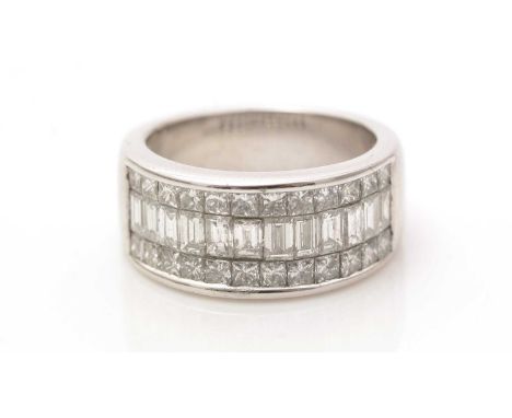 A diamond half-hoop eternity ring, set with baguette and princess cut diamonds weighing a total of approximately 2.40 carats,