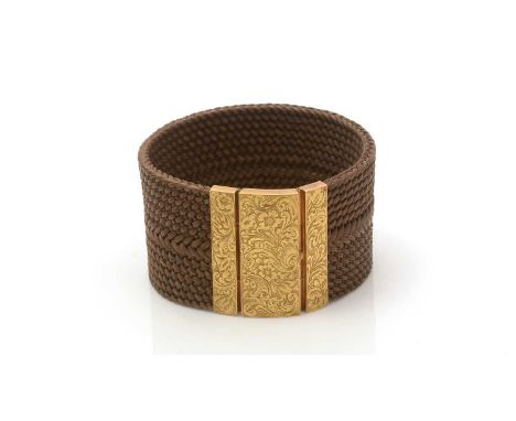 An early Victorian plaited hair and 18ct yellow gold cuff bracelet, the plaited hair set to an 18ct gold mount engraved with 