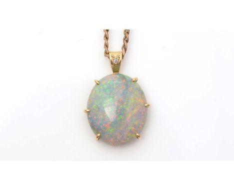 An opal pendant, the oval opal cabochon measuring approximately 24 x 20 x 6.3mm in a gold mount, unmarked but tests at approx