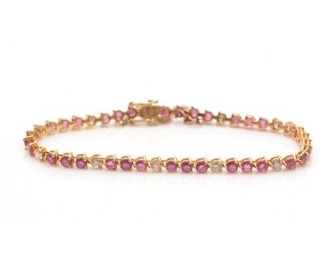 A diamond and ruby line bracelet, set with circular facet-cut rubies and brilliant cut diamonds, in 18ct yellow gold mount, 1