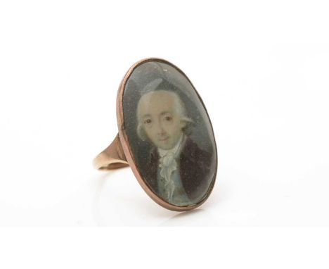 An 18th Century miniature set mourning ring, the oval painted portrait miniature of a gentleman, in gold mount and shank, unm