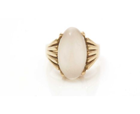 A moonstone ring, the oval moonstone cabochon measuring 16.8 x 9.4 x 5.8mm, in 14ct yellow gold mount with fluted shoulders a