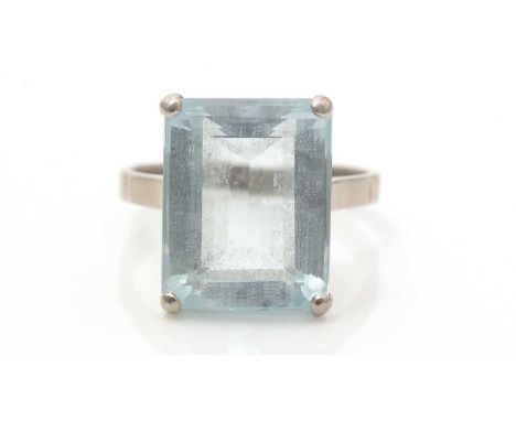 An aquamarine ring, the rectangular step-cut aquamarine measuring 15.2 x 12.2 x 7.6mm, in white gold mount and shank, unmarke