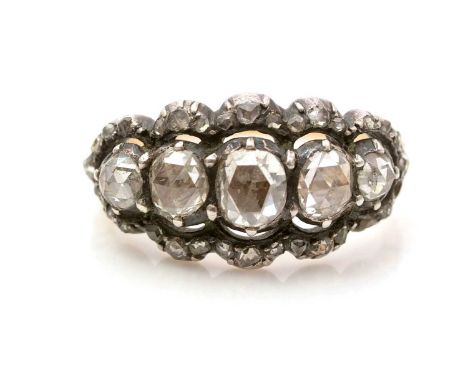 An early 19th Century diamond ring, the five principal graduated rose-cut diamonds closed back and surrounded by a bezel of s