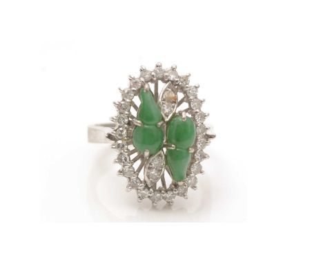 A jade and diamond ring, the two gourd-shaped jade cabochons surrounded by eight-cut diamonds, in 18ct white gold mount and s