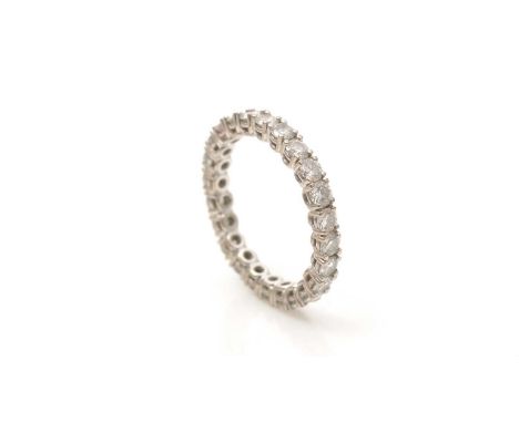 A diamond eternity ring, set with twenty-four brilliant cut diamonds weighing a total of approximately 1.20 carats, in 18ct w