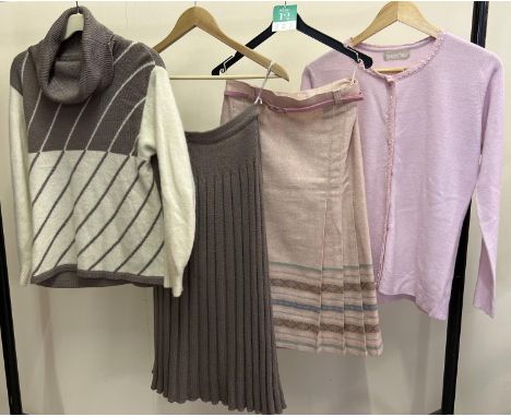 A collection of vintage and modern women's clothes to include a woollen skirt and jumper suit, and a border print wool mix sk