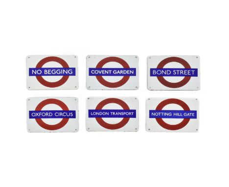 A set of six later reproduction London railway souvenir enamel signs. Each in the form of the icon London underground signage