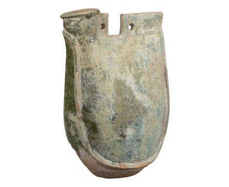 CHINESE GREEN-GLAZED PILGRIM FLASK, LIAO DYNASTY  Of saddle form with short cylindrical neck and two hanging holes for carryi