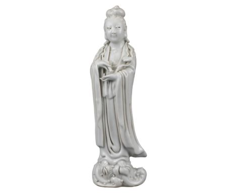 CHINESE BLANC DE CHINE PORCELAIN FIGURE OF GUANYIN, QING DYNASTY  Standing on reeds, dressed in robes holding a ruyi sceptre 