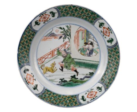 CHINESE FAMILLE VERTE PORCELAIN DISH, KANGXI PERIOD, 18th CENTURY  Decorated with male figure chasing a dog and a courting co