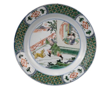 CHINESE FAMILLE VERTE PORCELAIN DISH, KANGXI PERIOD, 18th CENTURY  Decorated with male figure chasing a dog and a courting co