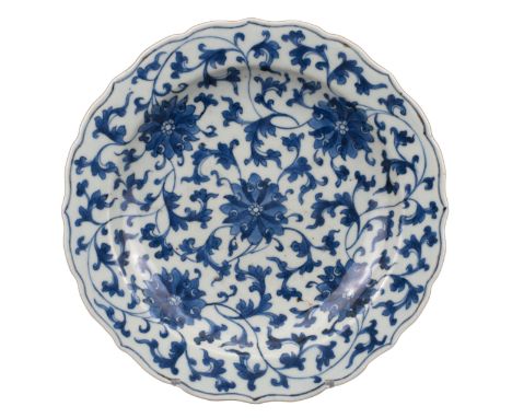 CHINESE BLUE AND WHITE LOBED PORCELAIN DISH, 18th CENTURY  With bracket-lobed rim decorated with five chrysanthemum heads and