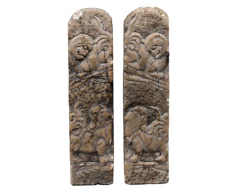 PAIR OF CHINESE CARVED SOAPSTONE SEALS  Carved in relief with lion dogs amongst clouds. Each with carved seal marks to base. 