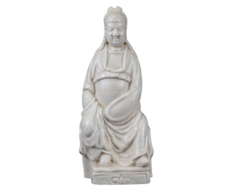 CHINESE BLANC DE CHINE PORCELAIN FIGURE OF GUANDI, 17/18th CENTURY  The God of War seated dressed in belted robe with pierced