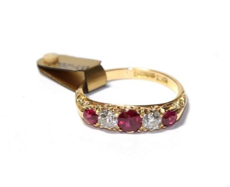 A synthetic ruby and diamond five stone ring, three graduated round cut synthetic rubies alternate with old cut diamonds, in 