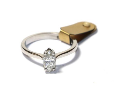 A diamond solitaire ring, the marquise cut diamond in a white claw setting, to a tapered shoulder plain polished shank, estim