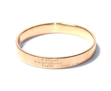 A bangle, stamped '9CT' and engraved 'I.F. Stuart, Blackruthven, Perth.', measures 6.2cm by 6.5cm .  Gross weight 15.5 grams.