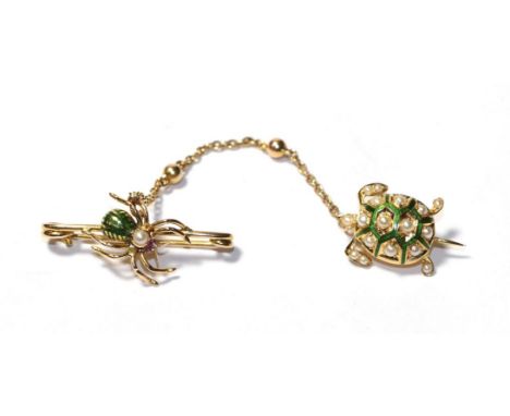 An enamel, ruby and split pearl tortoise and spider scatter brooch.  The brooch is in good condition. It bears no hallmark no